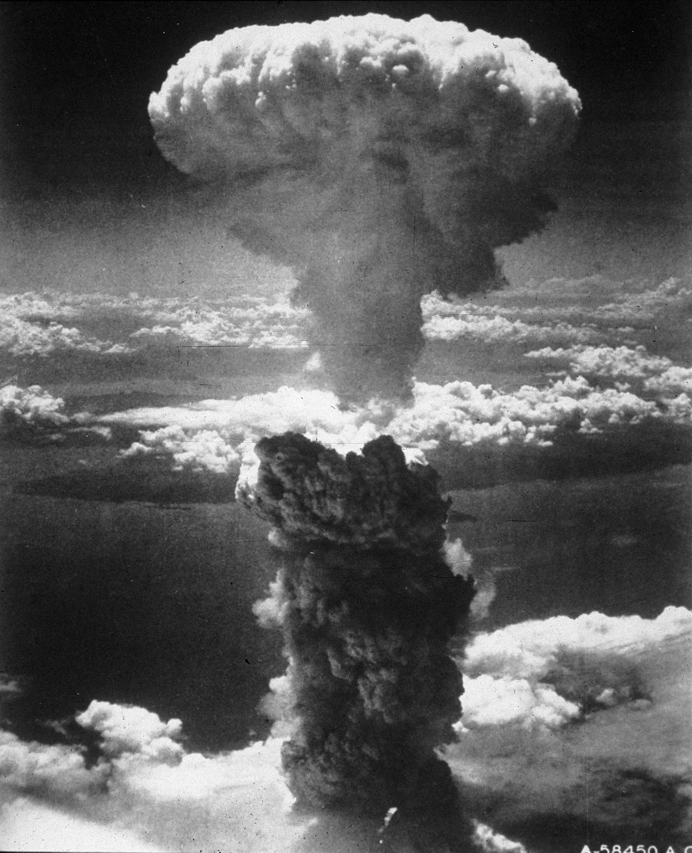 A massive mushroom cloud rises high into the sky over Nagasaki, Japan, following the detonation of the atomic bomb, August 9, 1945.