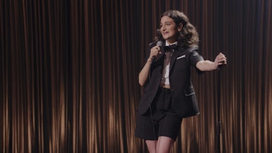 Jenny Slate on stage in her new special, "Seasoned Professional"