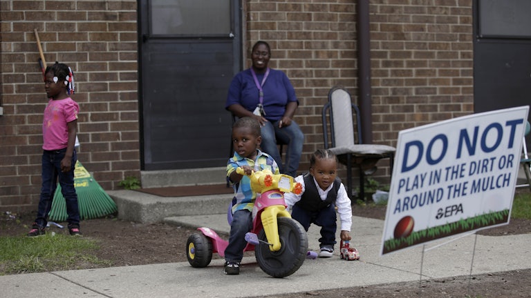 Children play at the West Calumet Housing Complex, which has been found to contain high levels of lead and arsenic.