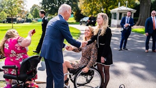 Biden greets guests during a celebration of the Americans with Disabilities Act
