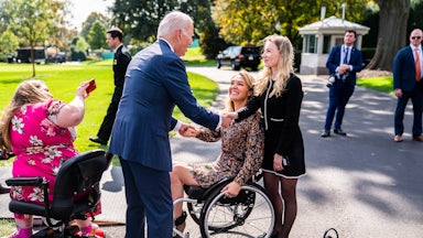 Biden greets guests during a celebration of the Americans with Disabilities Act