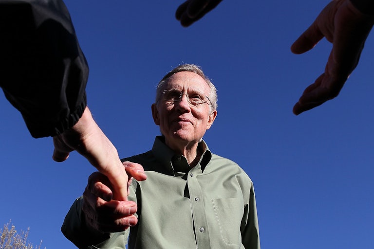 Senator Harry Reid reached out to shake hands.