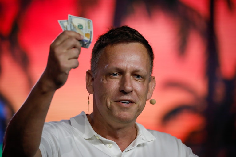 Peter Thiel waves $100 bills 