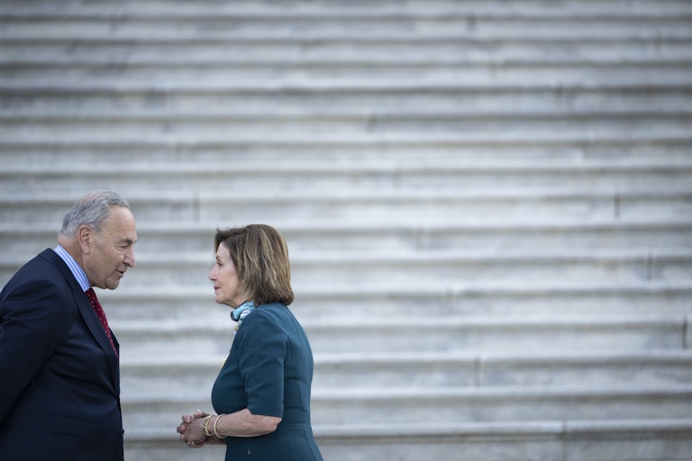 Chuck Schumer and Nancy Pelosi have a chat on the steps of the U.S. Capitol.