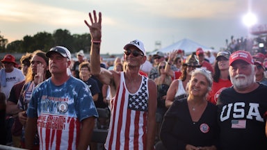 Supporters of Donald Trump listen to him speak at the Lorain County Fairgrounds in Wellington, Ohio