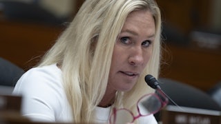 Marjorie Taylor Greene looks to the side