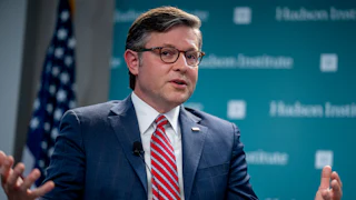 Mike Johnson gestures as he speaks