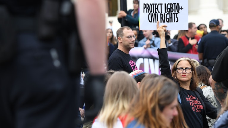 Demonstrators in favor of LGBTQ rights rally outside the US Supreme Court in Washington, DC
