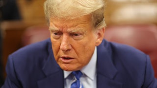 Donald Trump looks down