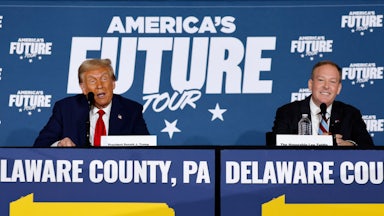 Trump and Zeldin sit in front of a banner reading "America's Future Tour."