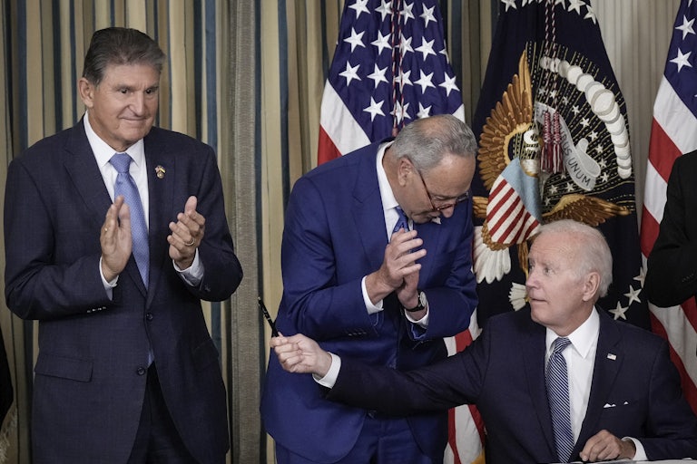 Biden gives Senator Joe Manchin the pen he used to sign the Inflation Reduction Act