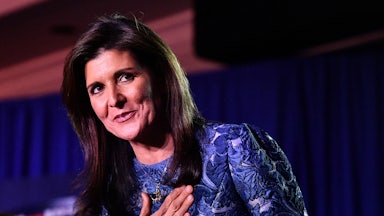 Nikki Haley smiles and puts her hand over her heart after losing the New Hampshire primary in January