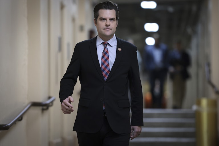 Matt Gaetz walks down a hallway