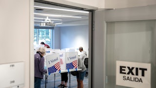 People vote at a polling station