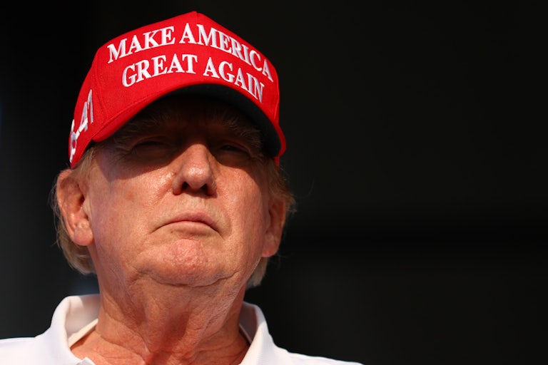 Donald Trump wears a Make America Great Again hat