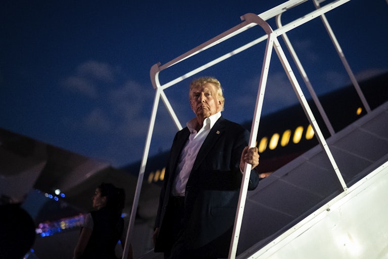 Trump disembarks his airplane 