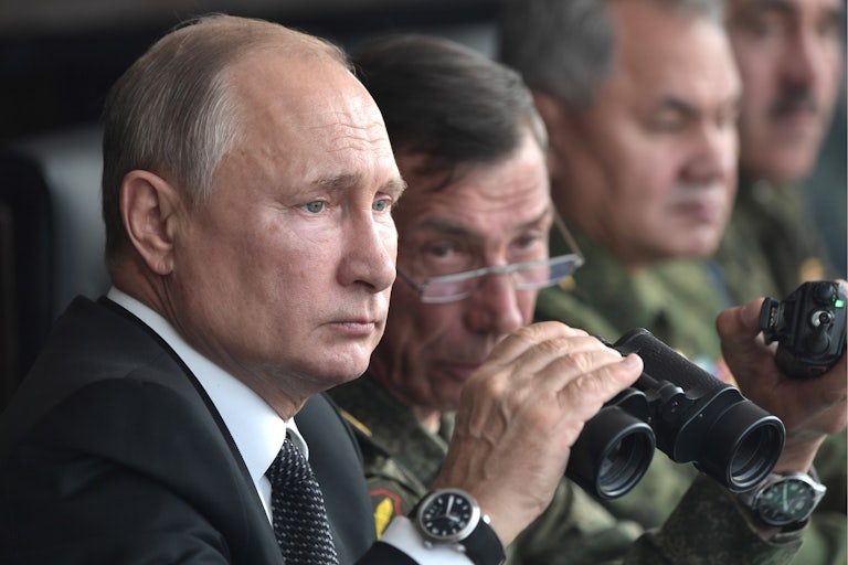 Vladimir Putin watches a military exercise in 2019