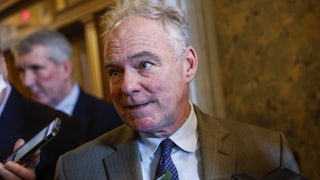 Sen. Tim Kaine speaks to reporters during a vote in the Senate Chambers of the U.S. Capitol Building on January 25, 2024 in Washington, DC.