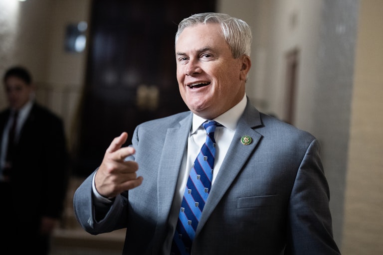 James Comer smiles and points at reporters
