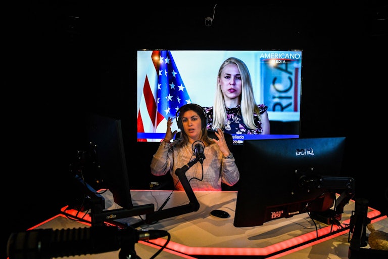 Host of conservative Spanish-language media network Americano Media Group Dianelys Guerra works in her studio in Miami, Florida. 
