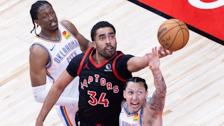Jontay Porter of the Toronto Raptors fights for a rebound during a match with the Oklahoma City Thunder in Toronto, Canada.