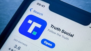 The TruthSocial app is seen on a phone screen