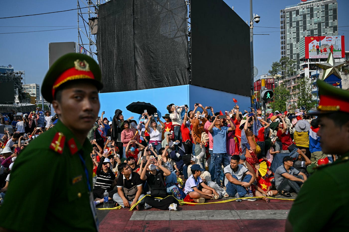 Spectators watch an airshow during celebrations in Ho Chi Minh City
