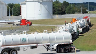 Tanker trucks line up at a Colonial Pipeline facility.