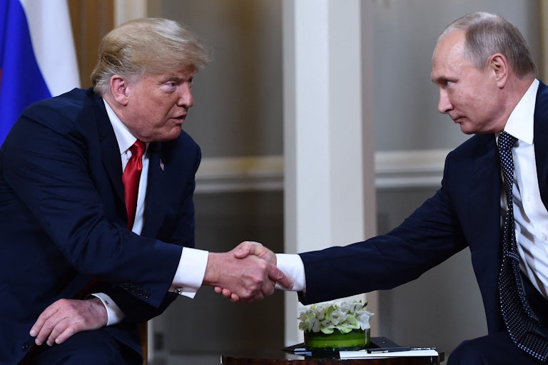 Donald Trump and Vladimir Putin shake hands