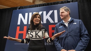 Former UN ambassador and 2024 Republican presidential hopeful Nikki Haley speaks to the press with New Hampshire Governor Chris Sununu at a town hall campaign event at Kennett High School in North Conway, New Hampshire.