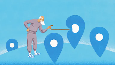 An elderly person is poking a locator, which represents a Blue Zone certification