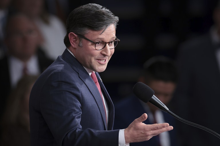 House Speaker Mike Johnson speaks at a lectern