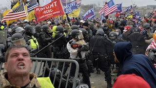 Trump supporters clash with police and security forces as people try to storm the U.S. Capitol Building on January 6, 2021.