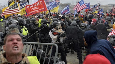 Trump supporters clash with police and security forces as people try to storm the U.S. Capitol Building on January 6, 2021.