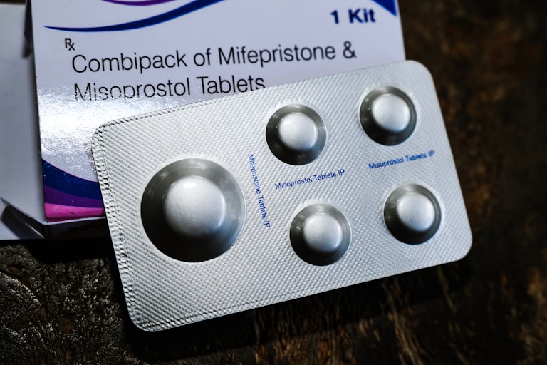 Box that reads "Combipack of Mifepristone and Misoprostol Tablets" and some pills in front of it