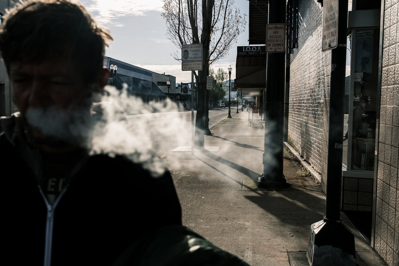 Jeromie Wharregard an unhoused resident of Grants Pass, walks through the town’s historic district