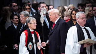 President Donald Trump looks at Rev. Mariann Budde as he attends the national prayer service at the Washington National Cathedral on Tuesday, Jan 21, 2025 in Washington, D.C.
