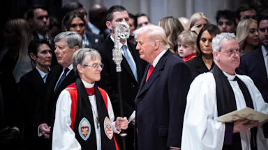 President Donald Trump looks at Rev. Mariann Budde as he attends the national prayer service at the Washington National Cathedral on Tuesday, Jan 21, 2025 in Washington, D.C.