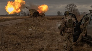 Ukrainian soldiers shoot artillery toward Russian positions in the Donetsk region of Ukraine