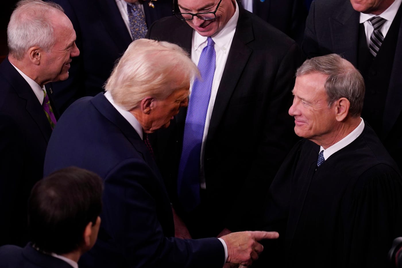 President Donald Trump greeted John Roberts, chief justice of the Supreme Court, on March 4, before Trump’s address to a joint session of Congress.
