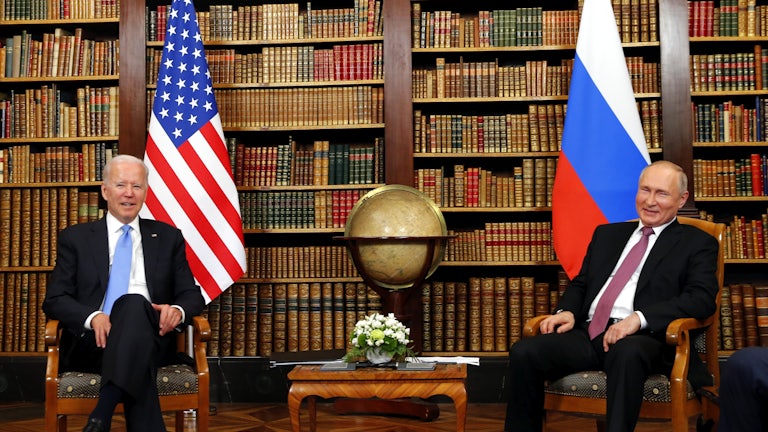 President Joe Biden and Russia's President Vladimir Putin sit across from each other at a summit in Geneva, Switzerland.