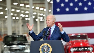 Joe Biden speaks at a podium.
