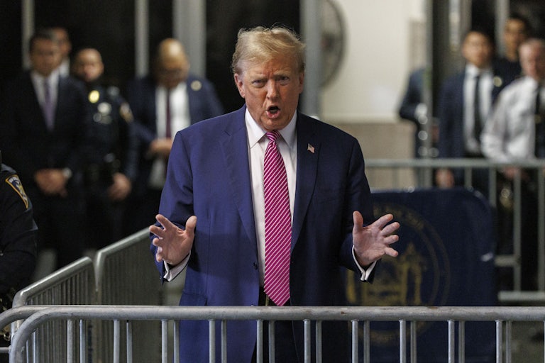 Trump gestures as he speaks