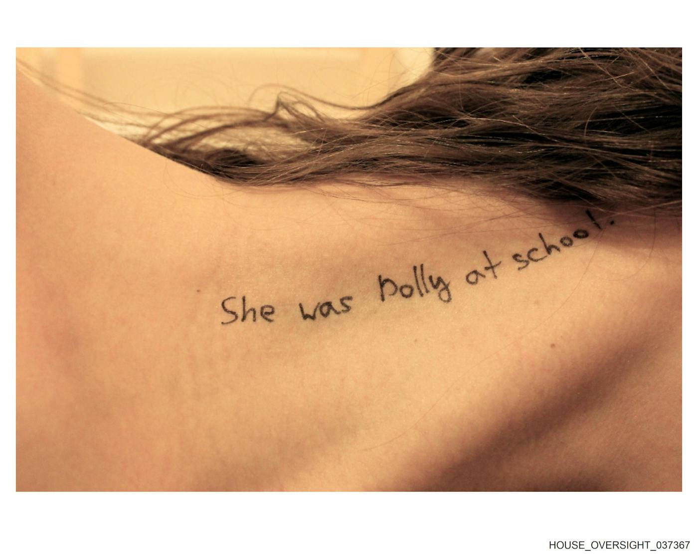 "She was Polly at school," written on a girl's neck (face unpictured, brunette hair)