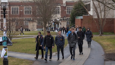 Students walk on a path outside on Princeton University campus.