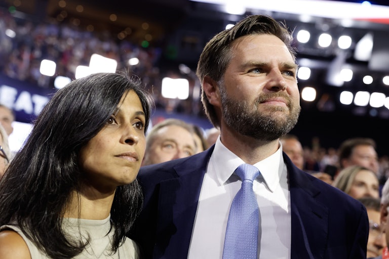 Usha Vance and J.D. Vance stand side by side on the RNC floor