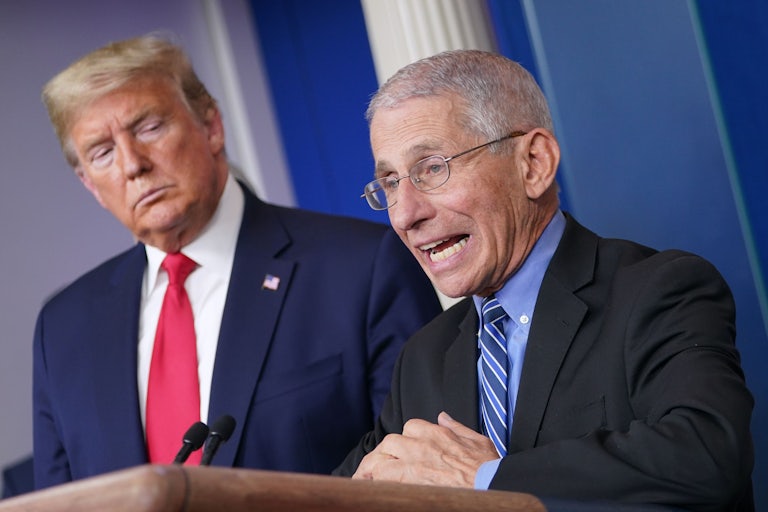 President Trump watches Dr. Anthony Fauci during a briefing on coronavirus.