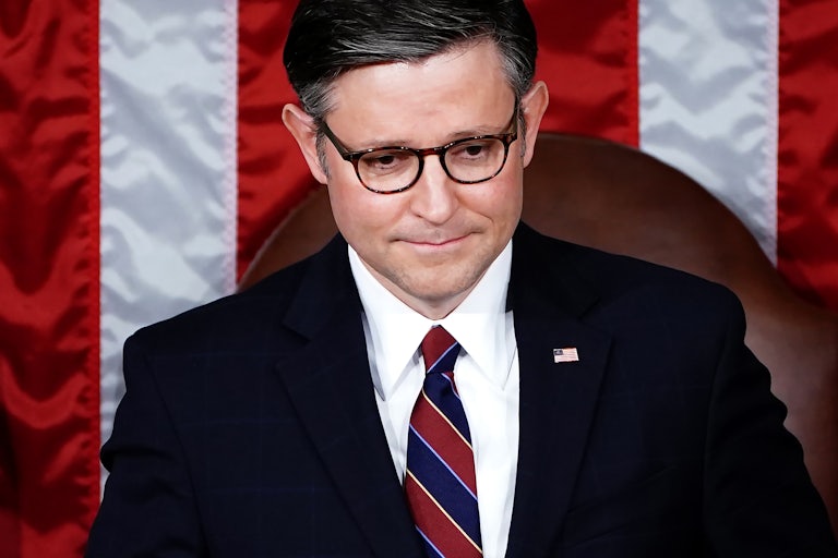 Mike Johnson looks slightly down