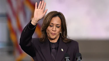 Kamala Harris waves at supporters at the end of her concession speech at Howard University on November 6, 2024.