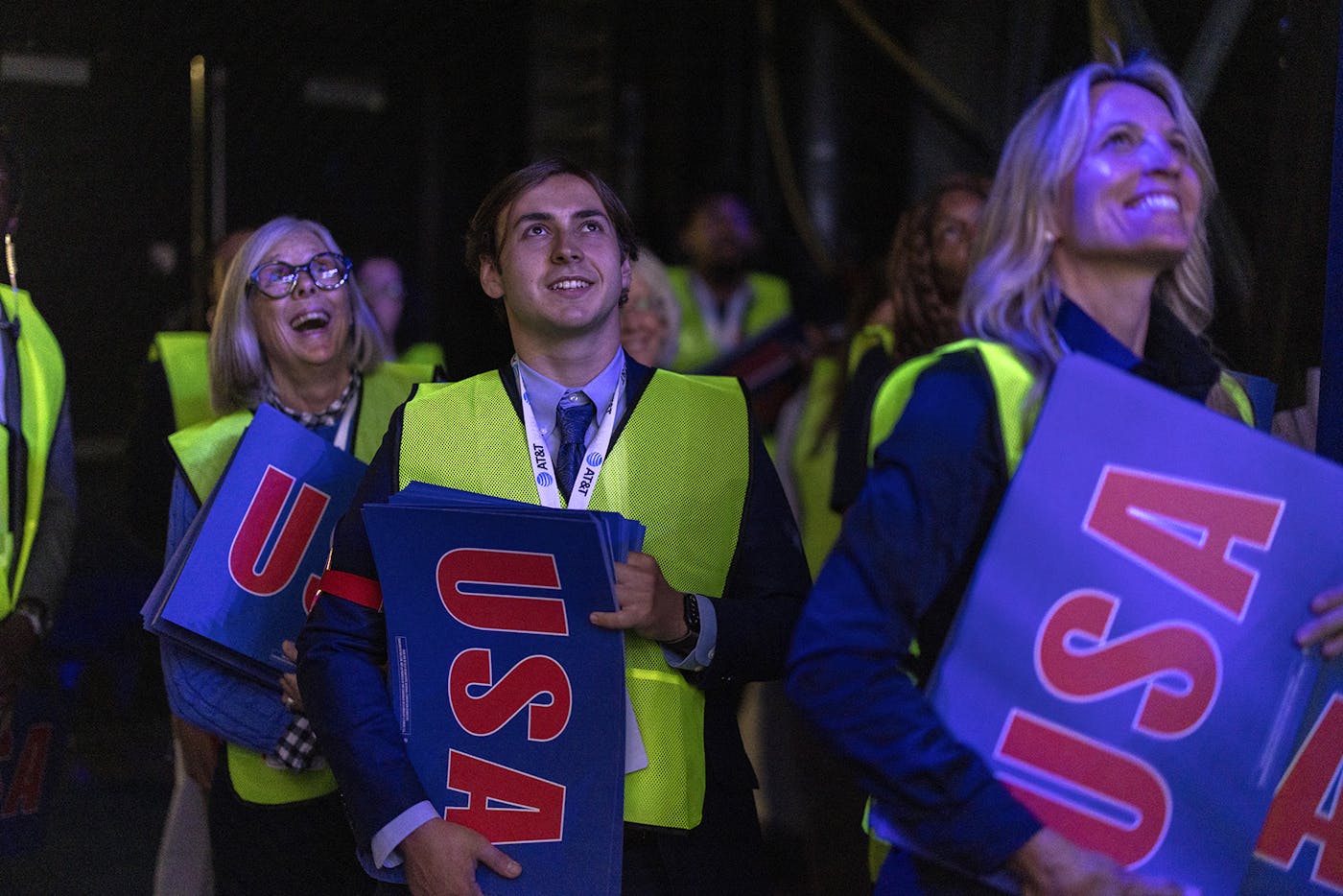 DNC volunteers with "USA" signs